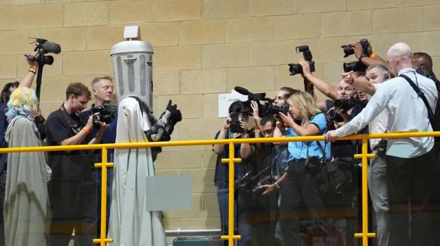 Count Binface arrives for the Clacton by-election at Clacton Leisure Centre in Essex. The by-election was triggered by local MP and Reform UK leader Nigel Farage quitting in protest at the scrutiny of his finances from the press and the parliamentary authorities. Picture date: Friday August 14, 2026