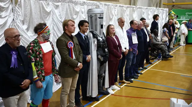 A wide shot of the line of candidates
