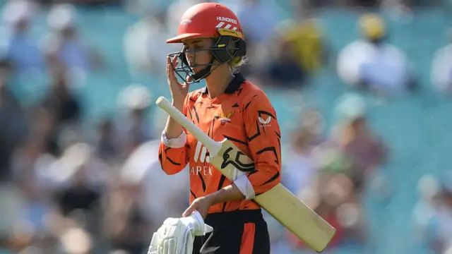 Phoebe Litchfield walks after being dismissed
