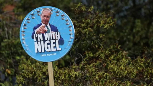 A round sign in support of Nigel Farage