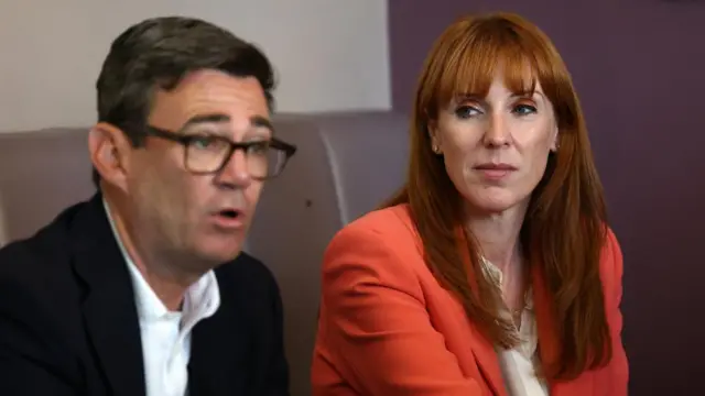 Burnham and Rayner sat together while Burnham speaks