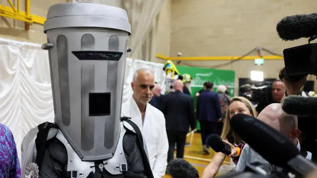 Close up of count Binface next to microphones