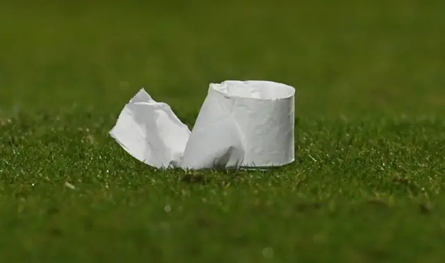 A toilet roll on the pitch
