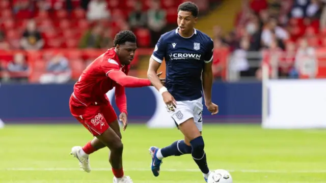 Aberdeen's Tony Yogane and Dundee's Joe Bevan