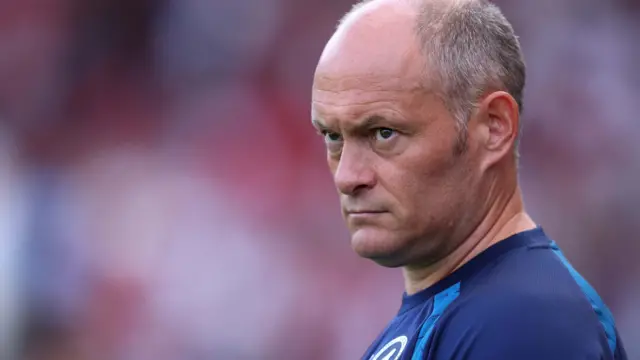 Alex Neil, wearing a blue Millwall training shirt, at Ashton Gate