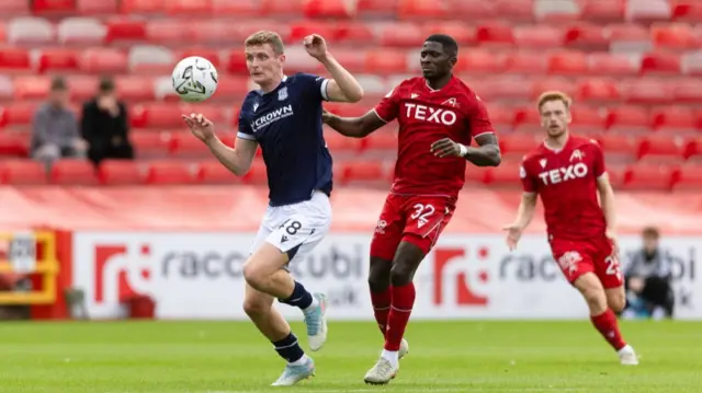 Dundee's Ethan Hamilton and Aberdeen's Afeez Aremu