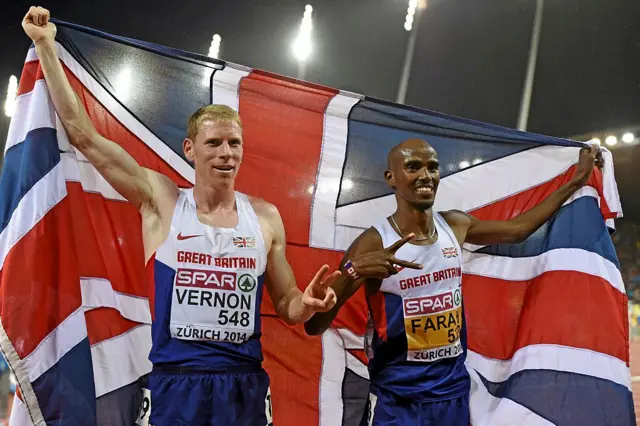 Winner Mo Farah, right, and second place Andy Vernon, Great Britain, celebrate after the men's 10,000m final