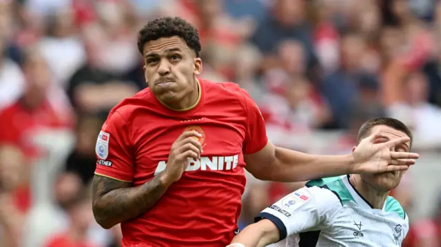 Neto Borges battles Dom Jeffries for the ball