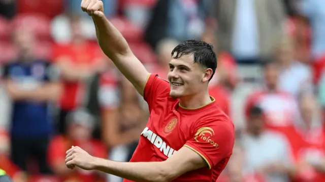 Will Lankshear celebrates after Middlesbrough's win over Lincoln City