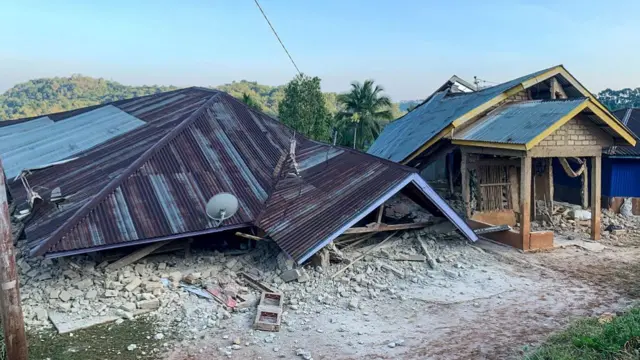 Damaged houses are seen following a 7.7-magnitude earthquake in Ruteng, Manggarai, East Nusa Tenggara, on August 15, 2026.