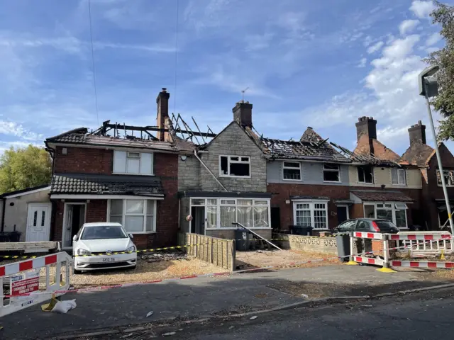 The timbers of a roof on house showing singed and burned in a fire