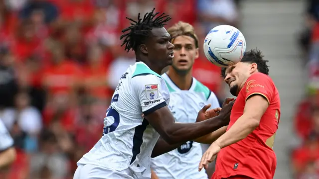 Deji Elerewe of Lincoln City and Kyle Joseph of Middlesbrough
