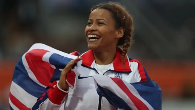 Jazmin Sawyers draped with a Great Britain flag around her after winning silver at the 2026 European Athletics Championships
