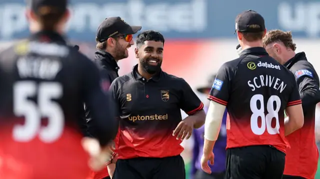 Rehan Ahmed celebrates the wicket of Ben Martindale