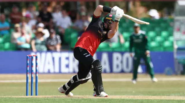 Nick Kelly drives down the ground