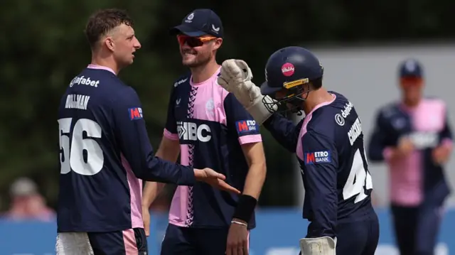 Luke Hollman celebrates his third wicket