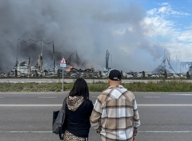People watch as Wildberries warehouse burns near Moscow on Sunday
