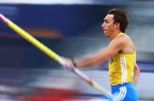 Duplantis runs with the pole