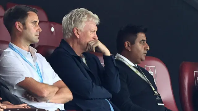 David Moyes (centre) holds his hand to his mouth as he watches from the stands