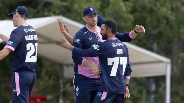 Zafar Gohar celebrates the wicket of Ben McKinney