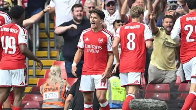 Tzolis celebrating