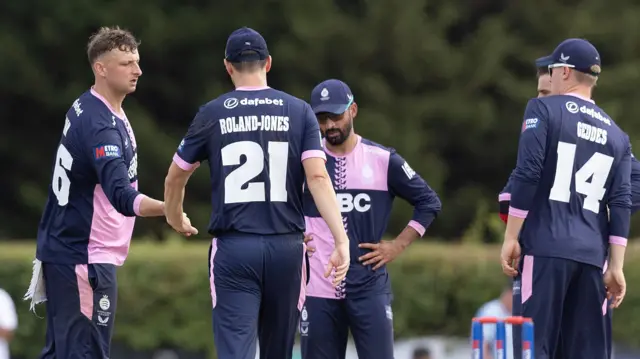 Middlesex celebrate the wicket of Will Rhodes