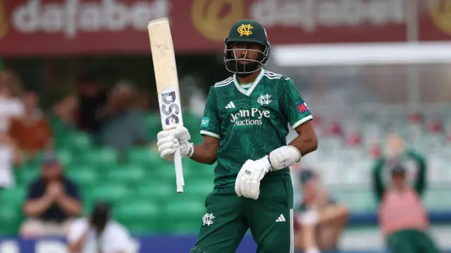 Haseeb Hameed raises his bat for his half-century