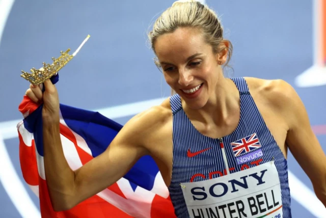 Britain's Georgia Hunter Bell celebrates with her national flag after winning gold in the women's 1500m final