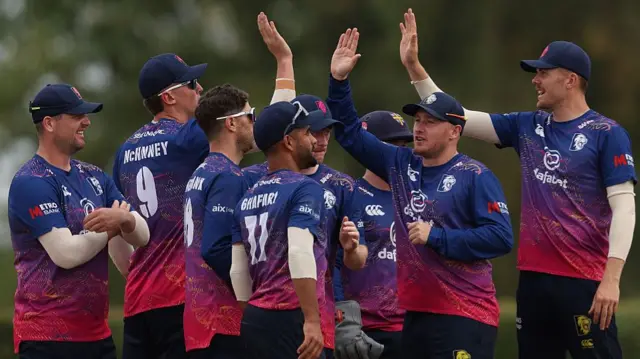Durham celebrate Ben McKinney's catch