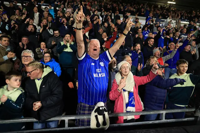 Cardiff City fans celebrate their win at Wrexham
