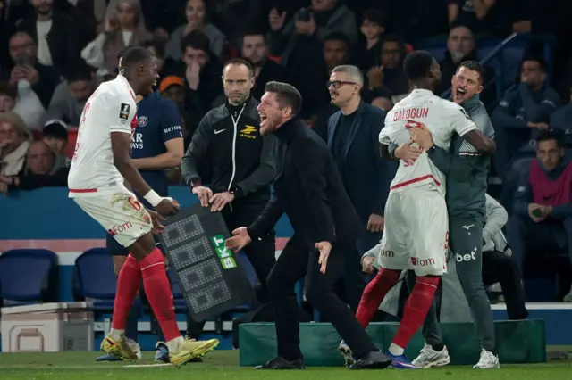 Pocognoli celebrates with Monaco players