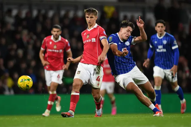 Rubin Colwill competes with Max Cleworth during last season's EFL Cup tie between Wrexham and Cardiff