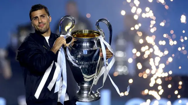 Rodri with the Champions League trophy at Pep Guardiola's leaving party