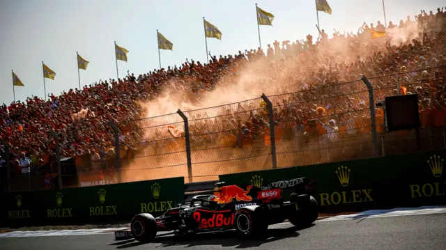 Dutch fans greet Red Bull's Max Verstappen with orange flares on the race's return to the F1 calendar in 2021
