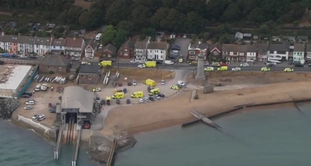 Helicopter view of several ambulances and police vehicles along Shoreham seafront