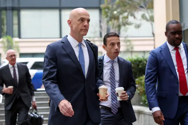 Attorney Paul W. Schmidt arrives before opening statements