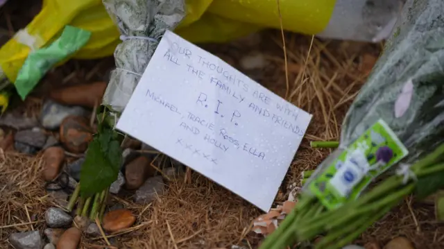 Floral tributes on the beach at Shoreham-by-Sea, West Sussex, near the RNLI station. Three members of the same family, including a man, a woman and a teenage girl, have died after getting into trouble in the water off Shoreham-by-Sea, while a younger girl from the same family is in a critical condition, Sussex Police have said. Picture date: Wednesday August 19, 2026