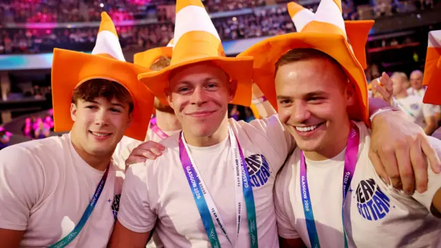 Scottish athletes with cones on their heads