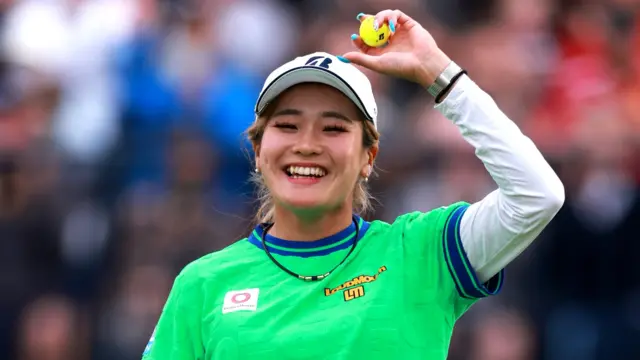 Shiho Kuwaki holds ball aloft
