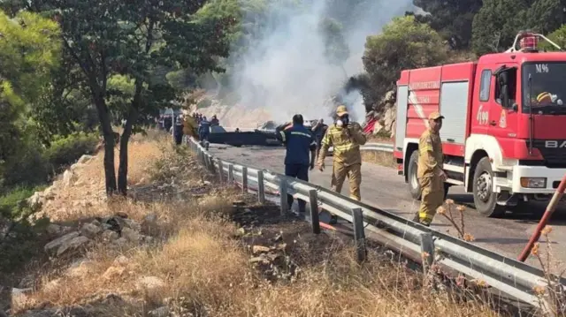 Firefighters at the site of the crash