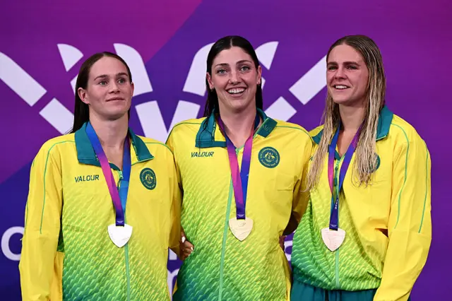 Gold medallist Meg Harris of Australia (centre) with silver medalist Alex Perkins and bronze medalist Shayna Jack after Australia swept the women's 50m freestyle medals