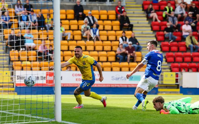 Jason Holt knocks the ball into his own net