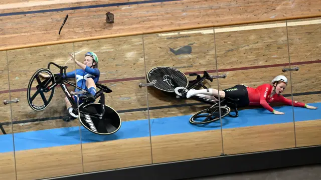 Rhian Edmunds and Lauren Bell crash at the Sir Chris Hoy Velodrome during the Commonwealth Games in Glasgow