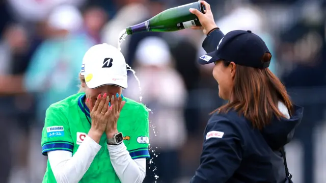 Shiho Kuwaki is covered in champagne