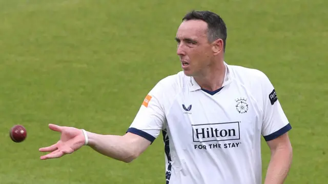 Kyle Abbott throwing the ball out of his right arm