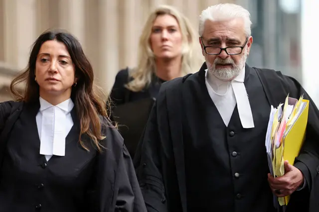 Veronika Drago and Richard Edney are speaking for Patterson in court