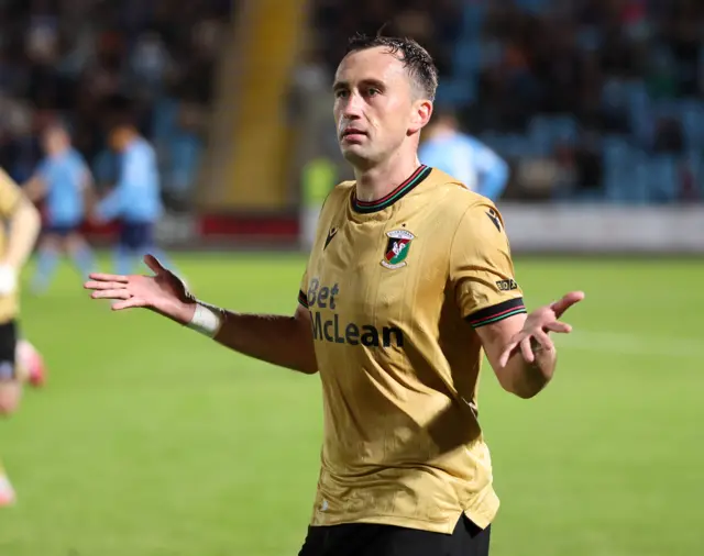 Aaron McEneff celebrates