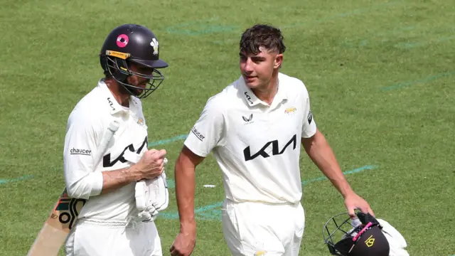 Ben Foakes (left) and Adam Thomas head off for lunch at The Oval
