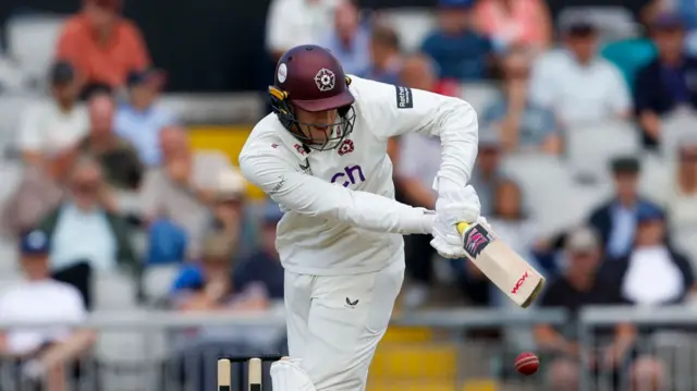 George Bartlett tucking a delivery along to the legside