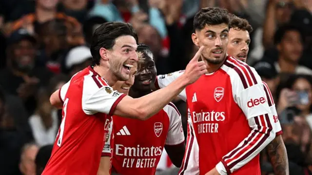 Bukayo Saka of Arsenal celebrates scoring his team’s second goal with teammates Declan Rice and Kai Havertz during the Premier League 2026/27 match between Arsenal FC and Coventry City at Emirates Stadium.